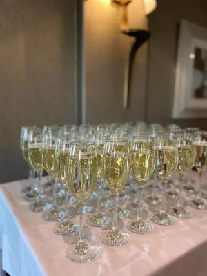 a row of wine glasses sitting on a table at The Fenwick Hotel in Kilmarnock