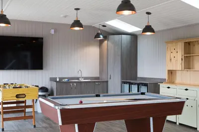 a kitchen with a pool table in a room at Great Calva, Sebergham, perfect for 2 families or friends with 3 dogs welcome and hot tub in Sebergham