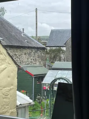 a view of a garden from a window of a house at Little Limetree in Moffat