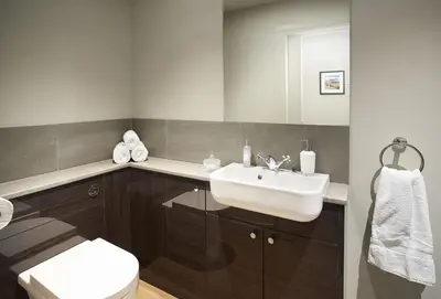 a bathroom with a sink and a toilet at Netherwood Lodge in Dumfries