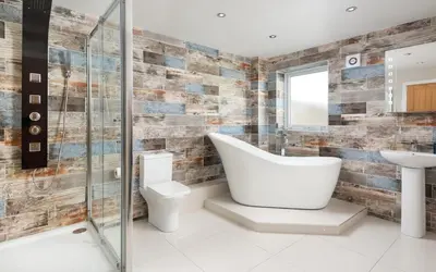 a bathroom with a tub and a toilet and a sink at Cottage - Sleeps 3 hot tub & pet friendly in Carlisle
