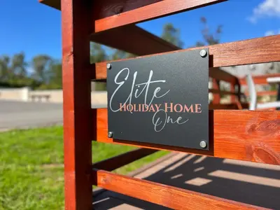 a sign on a fence that reads life holiday home line at Elite Holiday Caravan in Bassenthwaite