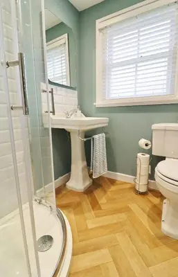 a bathroom with a sink and a toilet at 14 Union Street in Kirkcudbright