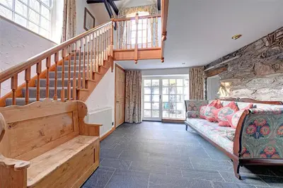 a living room with a staircase and a couch at 5 Bed in Grasmere oc-gl008 in Grasmere