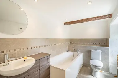 a bathroom with a sink toilet and a mirror at 3 Bed in Elterwater oc-gl011 in Chapel Stile