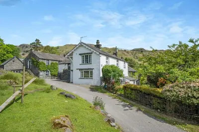 a white house on the side of a road at 3 Bed in Elterwater oc-gl011 in Chapel Stile