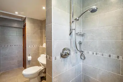 a bathroom with a shower with a toilet in it at 3 Bed in Elterwater oc-gl011 in Chapel Stile