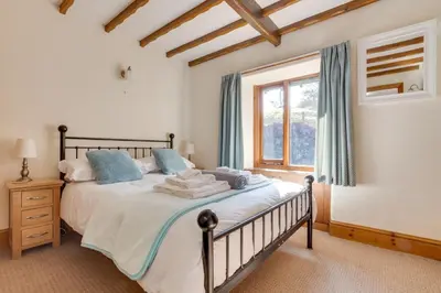 a bedroom with a bed and a window at 2 Bed in Grasmere oc-gl081 in Grasmere
