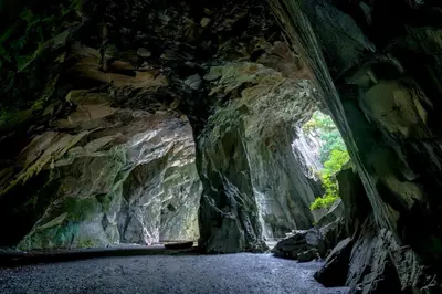 a tunnel in a cave with a rock wall at 3 Bed in Little Langdale oc-gl102 in Little Langdale