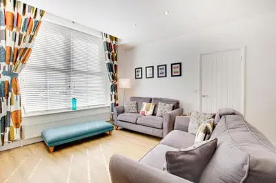a living room with two couches and a couch at 2 Bed in Portinscale oc-gl129 in Portinscale