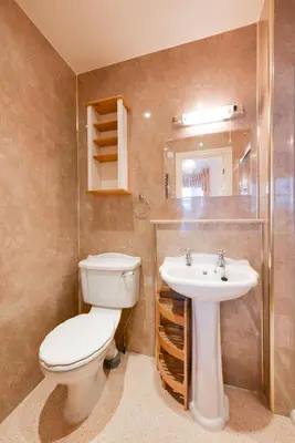 a bathroom with a toilet and a sink at 6 Bed in Keswick oc-ld177 in Keswick