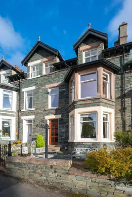 a large brick house with white windows at 6 Bed in Keswick oc-ld177 in Keswick