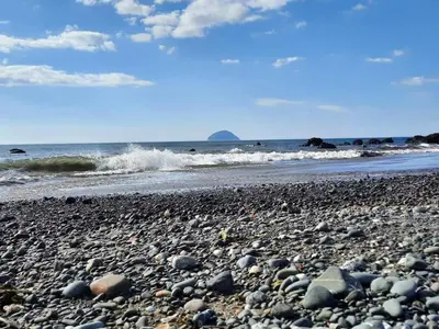 a rocky beach with the ocean in the background at The Sunny Bunny Holiday Home in Ballantrae