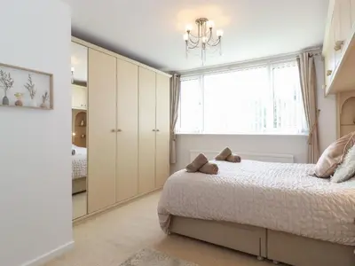 a bedroom with a bed and a window at Oaklea in Keswick