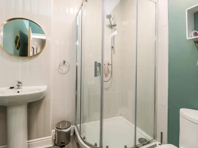 a bathroom with a shower and a sink at 8A Corkickle in Whitehaven