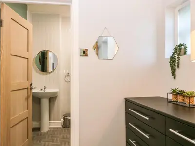 a bathroom with a sink and a mirror at 8A Corkickle in Whitehaven