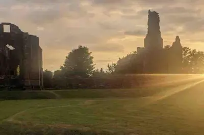 a view of the sun setting in a park at Lovely 2 bed apartment with hot tub log burner and off street parking in Dumfries