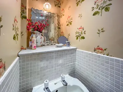 a bathroom with a sink and a mirror at Rose Cottage - Lpd in Ireby