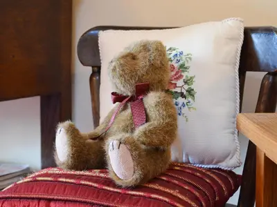 a teddy bear sitting on the back of a chair at Rosedale- Lyl in Ireby