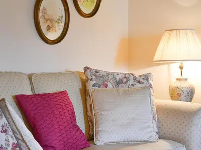 two pillows sitting on a couch in a living room at Rosedale- Lyl in Ireby