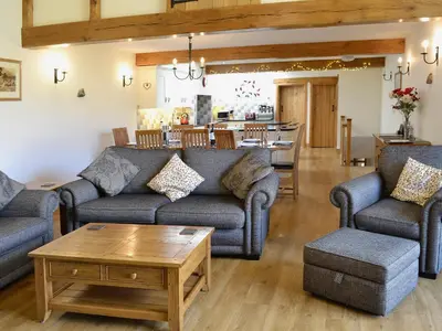 a living room with couches and a coffee table at Bram Crag Barn in Legburthwaite