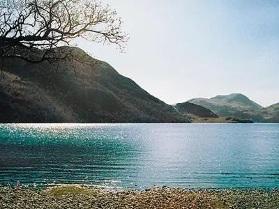 a view of a lake with mountains in the background at Aira Cottage in Watermillock