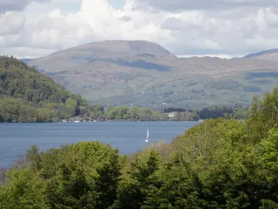 a view of a lake with a boat in the water at The Paddock in Keswick