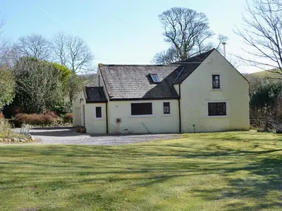 a large white house with a large yard at Arkland Mill in Corsock