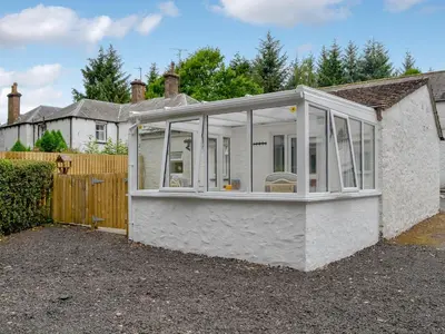an extension to a house with glass at Barnhill Bothy in Moffat