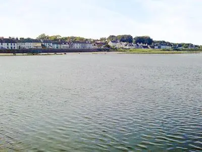 a large body of water with buildings in the background at Seaview in Garlieston