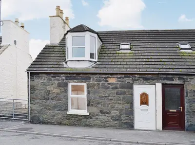 an old stone building with two windows and a door at Sea-Esta - 28175 in Port William