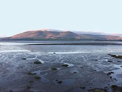 a large body of water with mountains in the background at Myrtle Cottage - 28177 in Fairgirth