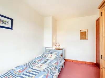 a bedroom with a bed in a room at Jura in Drummore