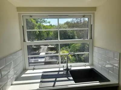 a kitchen sink in front of a window at Kirkcudbright Holiday Apartments - Apartment G in Kirkcudbright