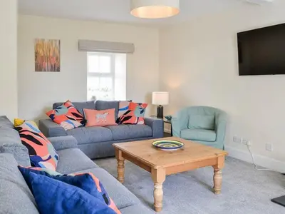 a living room with a couch and a coffee table at Blackloch in Gatehouse of Fleet