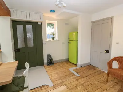 a kitchen with a green refrigerator and a table at Beech Croft in Keswick
