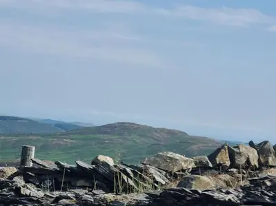 a rock wall on the top of a hill at Home from home in Maryport in Maryport