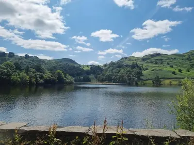 a view of a lake with hills in the background at Home from home in Maryport in Maryport