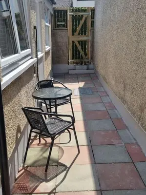 two chairs and a table on a patio at Home from home in Maryport in Maryport