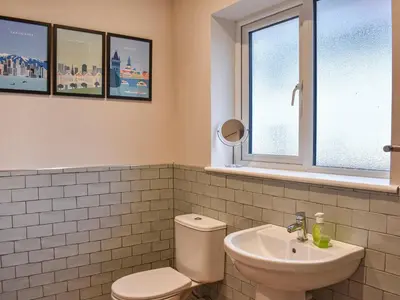a bathroom with a toilet and a sink at Tynedale in Keswick