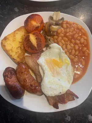a plate of breakfast food with eggs beans and toast at Seamore House in Moffat