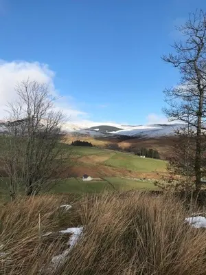 a view of a golf course with trees and snow at Seamore House in Moffat