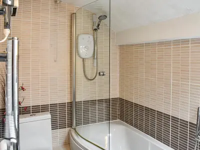 a bathroom with a shower and a tub and a toilet at High Spy in Bassenthwaite