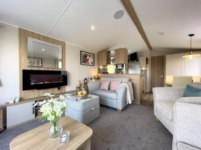 a living room with a couch and a table at Gorgeous Kippford Home With Outstanding Views - Pass the Keys in Kippford