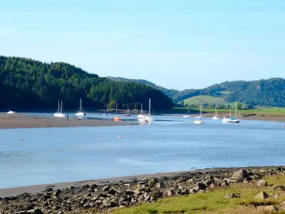a group of boats docked on a body of water at Gorgeous Kippford Home With Outstanding Views - Pass the Keys in Kippford