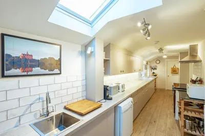a kitchen with a sink and a counter top at Kenmure Kennels in New Galloway