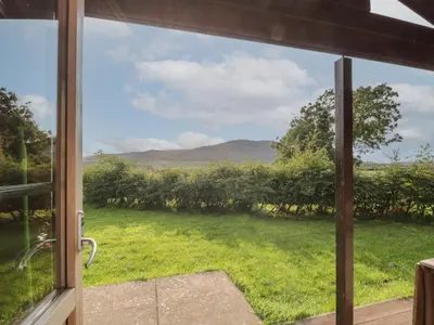 a view from a window of a yard at Lapwing Lodge in Dumfries