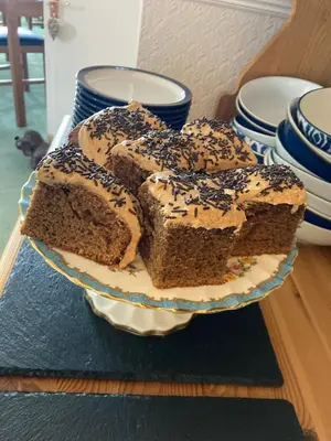 a plate with six slices of cake on a table at Maple Bank Country Guest House in Keswick