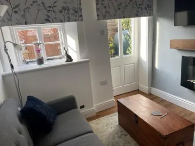 a living room with a couch and a coffee table at White House in Carlisle