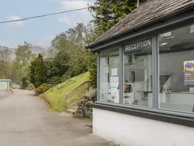 a shop with a window on the side of a road at Canadian Cabin 37 in Keswick
